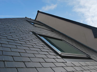 slate tiled roof with two velux windows